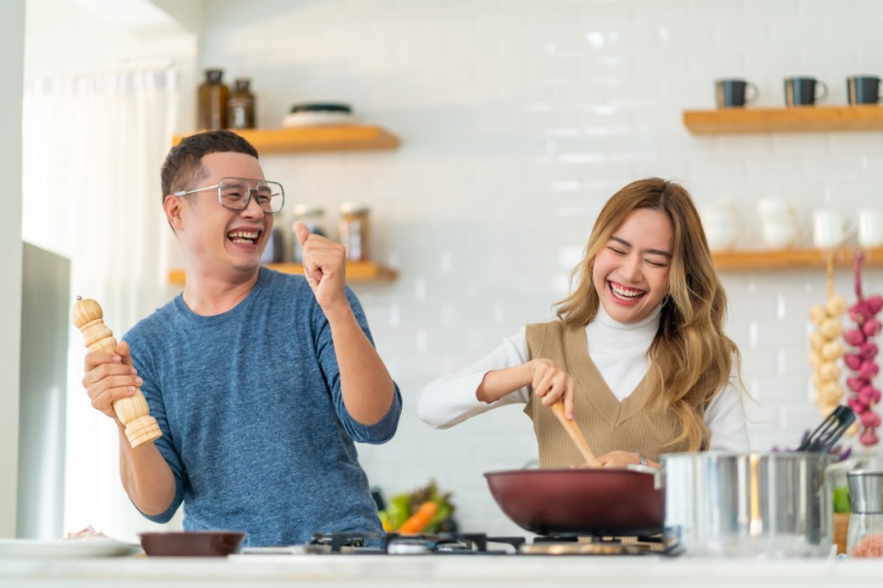 two friends cooking together