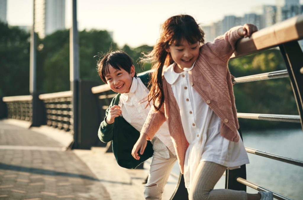 children playing outdoors siblings brothers and sister