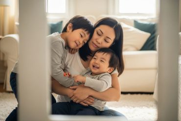 mother with her two childrne enjoying a hug