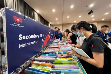 Beneficiaries choosing textbooks from Share-A-Textbook 2024