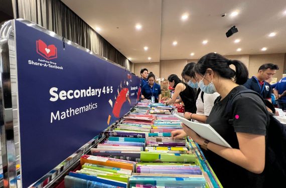 Beneficiaries choosing textbooks from Share-A-Textbook 2024