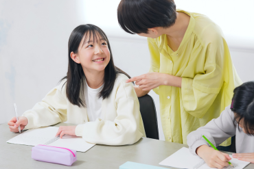 mother supporting child with studies
